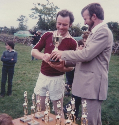 Conor Gavin presents the FR.Rafferty Cup to Pat McWalter in 1982